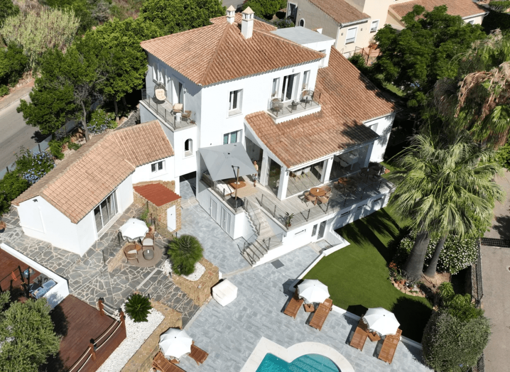 Boutique hotel exterior with swimming pool and Mediterranean landscaping on the Costa del Sol