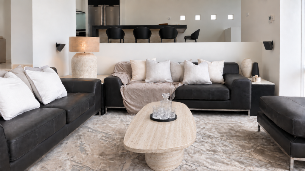 After: warm travertine coffee table in the completed living room.