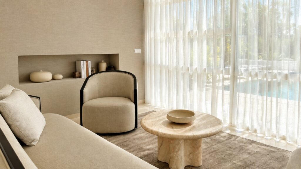 After: warm organic poolside living room with soft neutral textures.