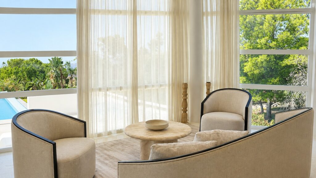 After: bright warm organic living room beside the pool.